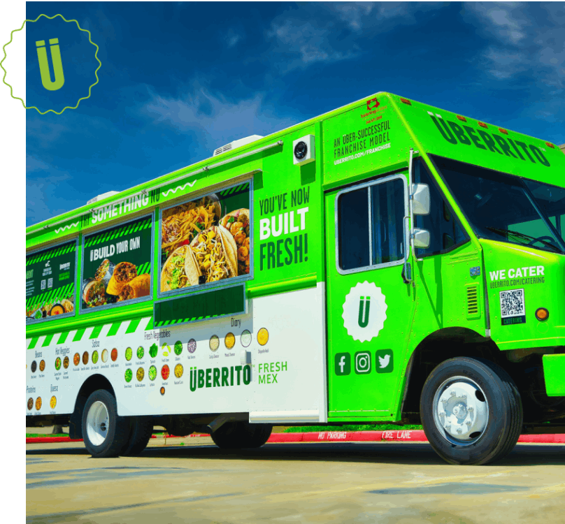 A green Uberrito food truck franchise parked in a parking lot.