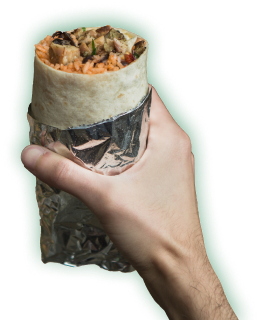 A hand holding a burrito wrapped in foil
