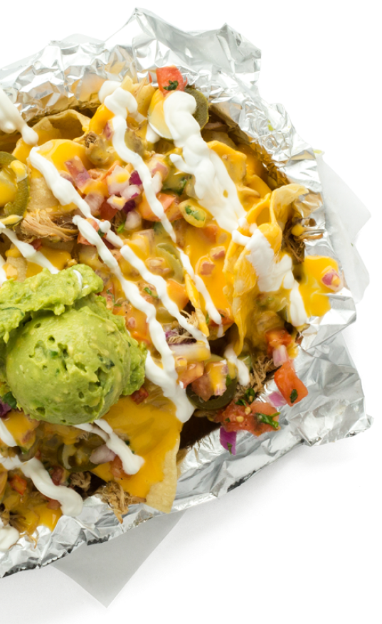 Uberritos Mexican franchise nachos in foil with guacamole and sour cream