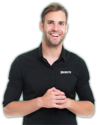An Uberrito Mexican Franchise staff smiling in a black shirt